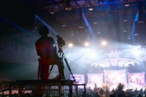 Camera man is making video of evening concert